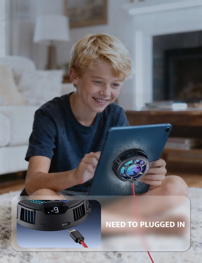 Child using a tablet with a robot vacuum cleaner in the foreground