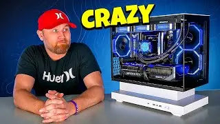 Person wearing a Hurley cap and shirt with a computer setup labeled 'CRAZY' 