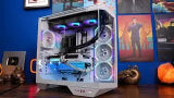 Computer case with RGB lighting on a desk with Halloween decorations